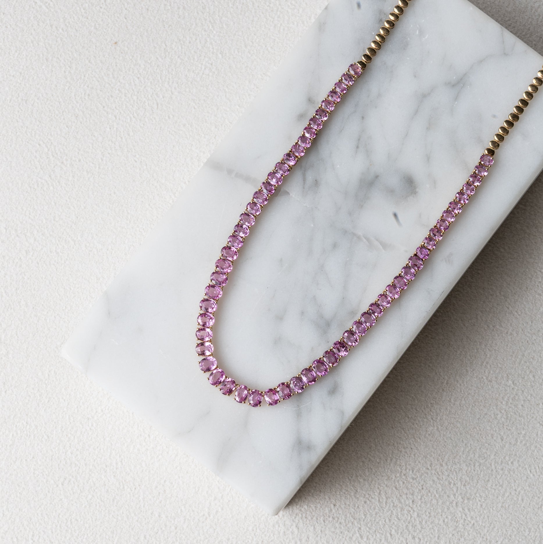 14 Karat Gold and Pink Sapphire 10.00cts Oval 16.00" Tennis Necklace