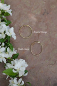 Load image into Gallery viewer, 18 Karat Yellow Gold Diamond Oval Hoops
