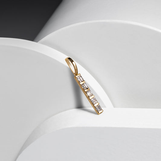 14 Karat Yellow Gold and Emerald Cut Diamond Single Line Pendant