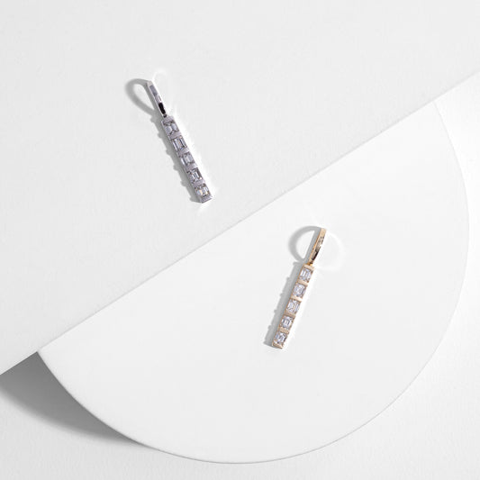 14 Karat White Gold and Emerald Cut Diamond Single Line Pendant