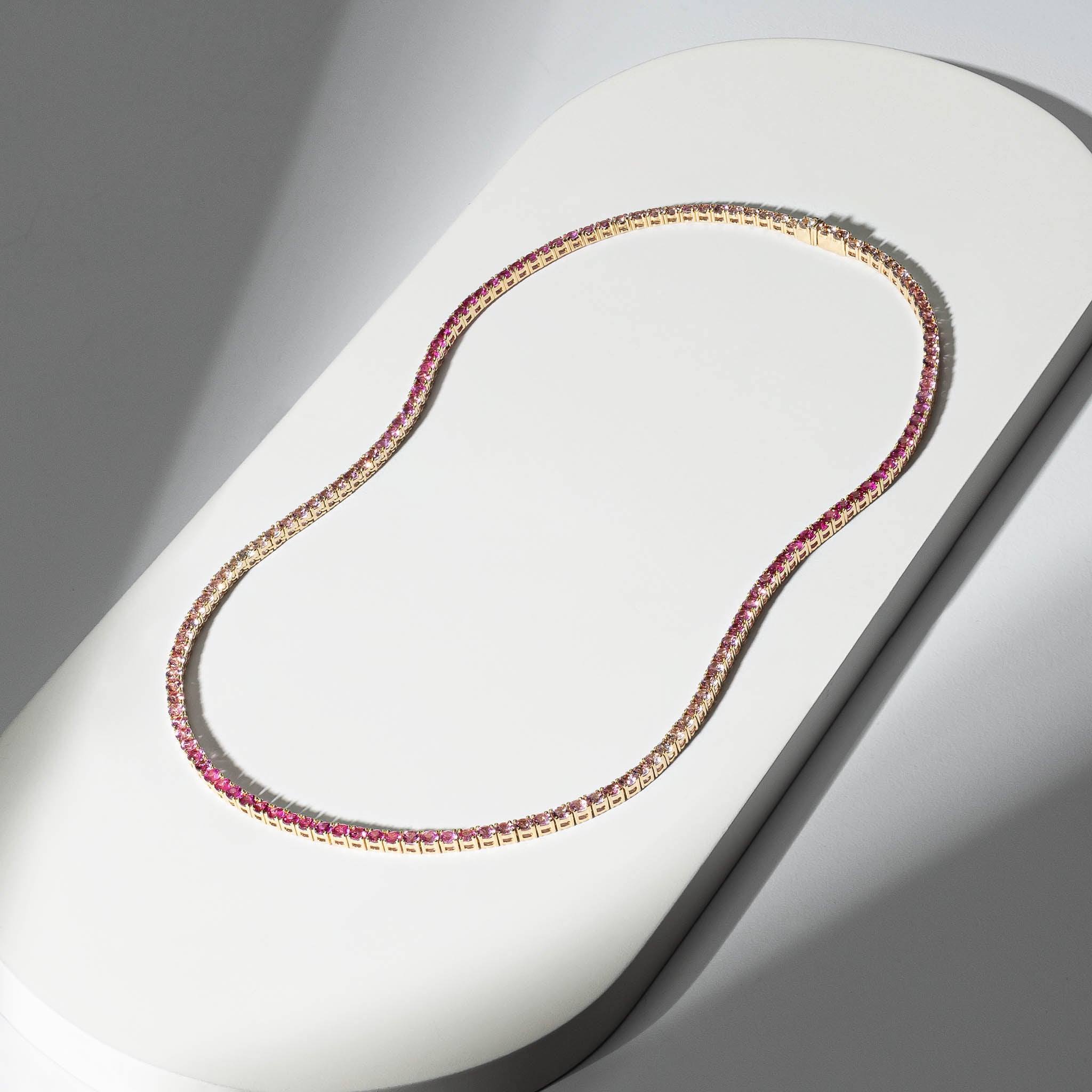 14 Karat Gold and Ombre Pink Sapphire 8.00cts Oval 16.00" Tennis Necklace