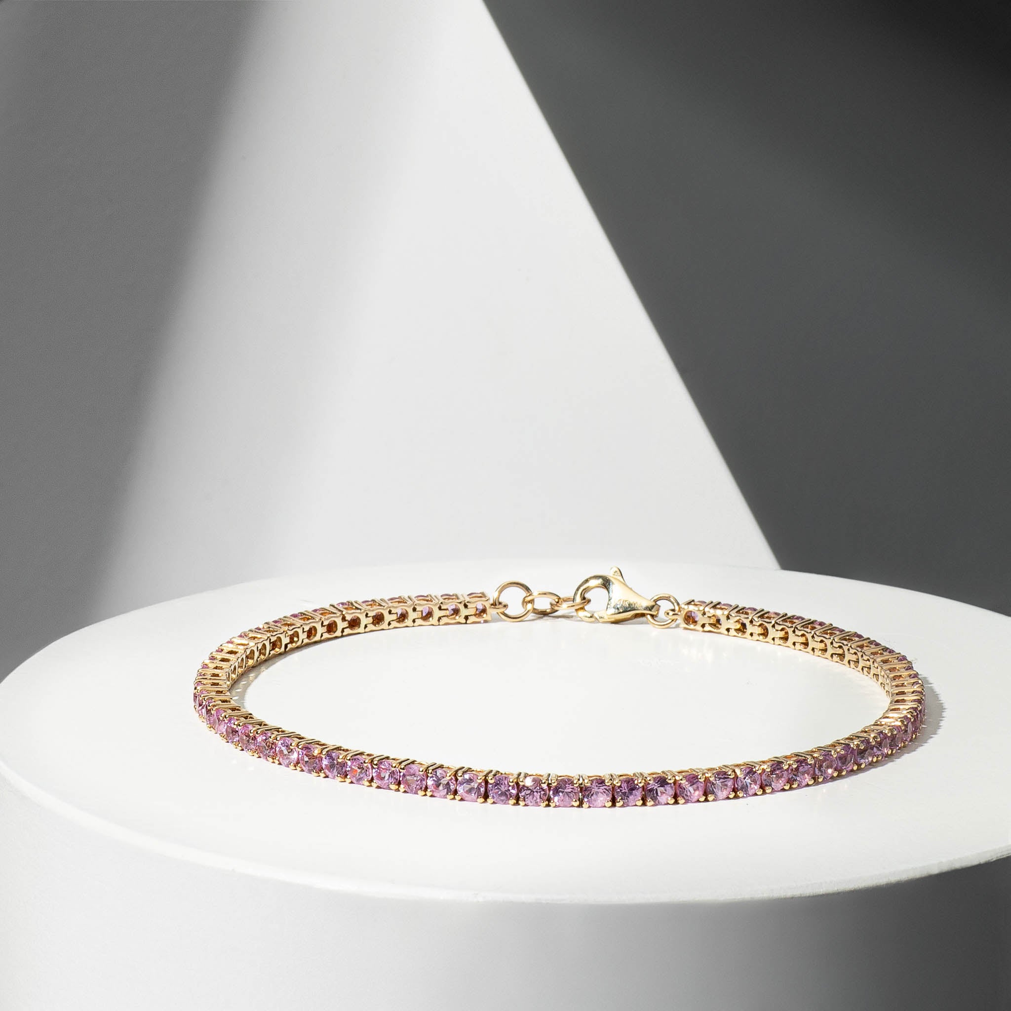 14 Karat Yellow Gold Pink Sapphire Tennis Bracelet