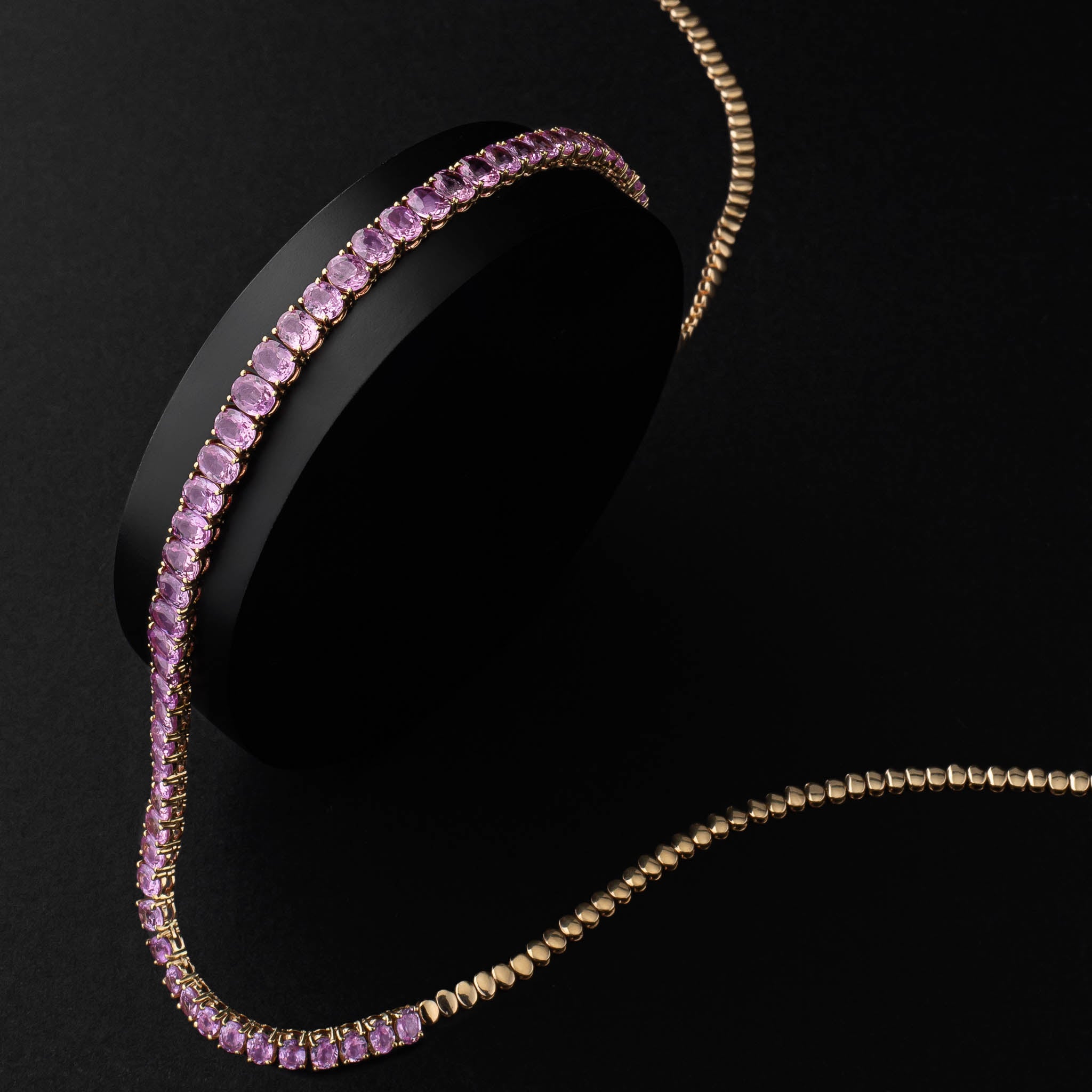 14 Karat Gold and Pink Sapphire 10.00cts Oval 16.00" Tennis Necklace