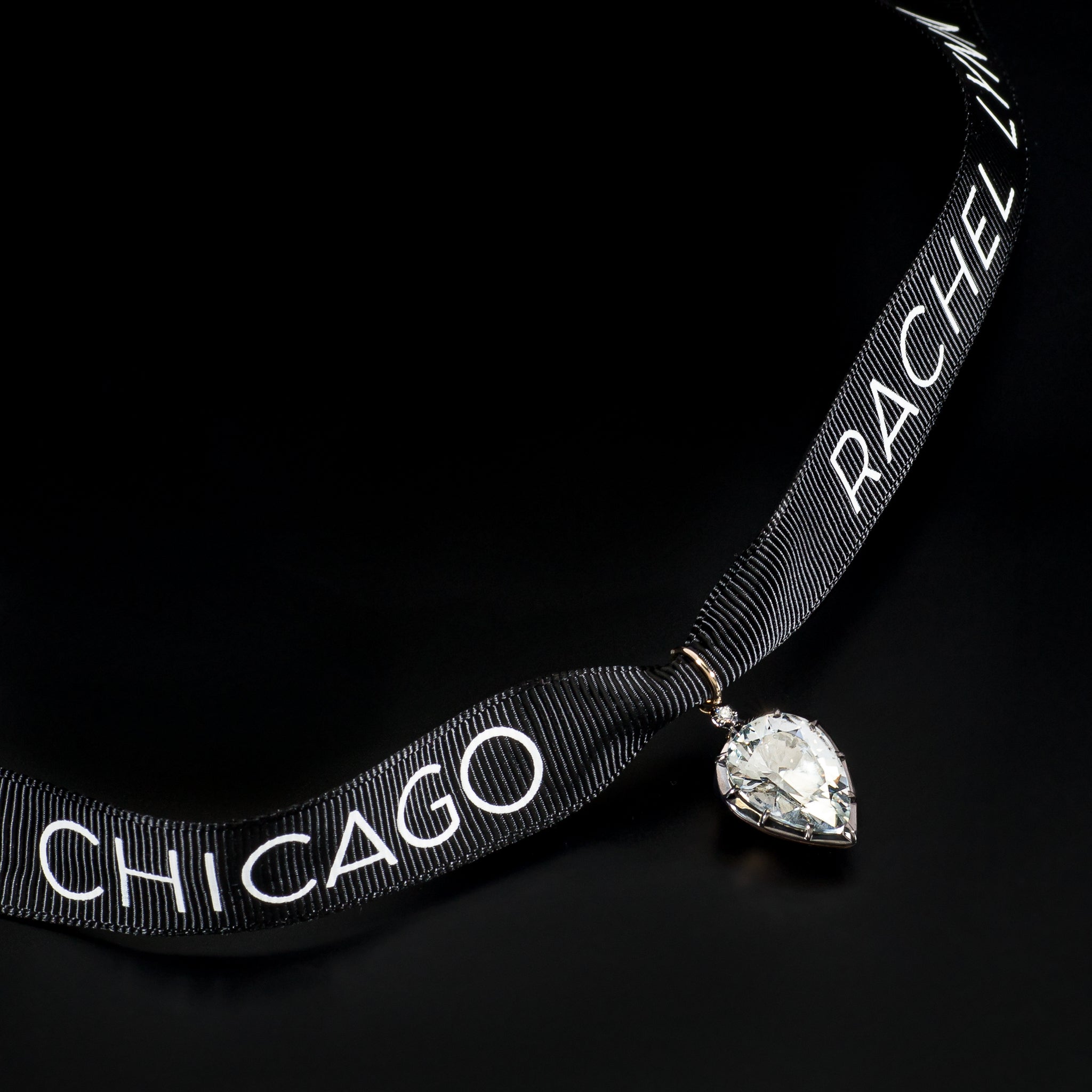 14 Karat Yellow Gold White Topaz Pear Charm