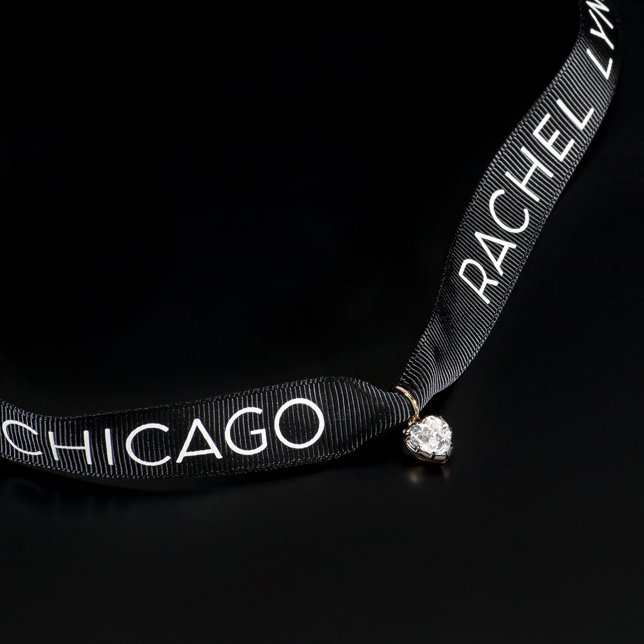 14 Karat Yellow Gold White Topaz Heart Charm