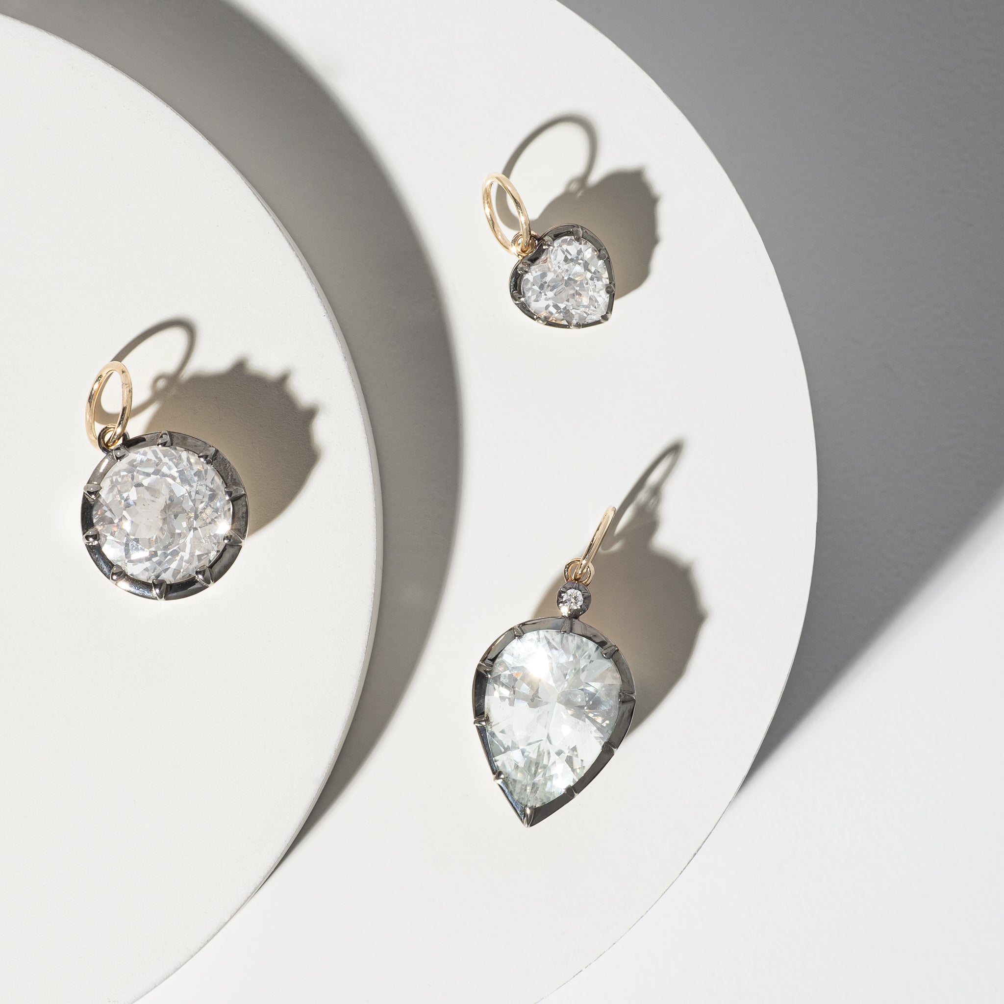 14 Karat Yellow Gold White Topaz Round Charm