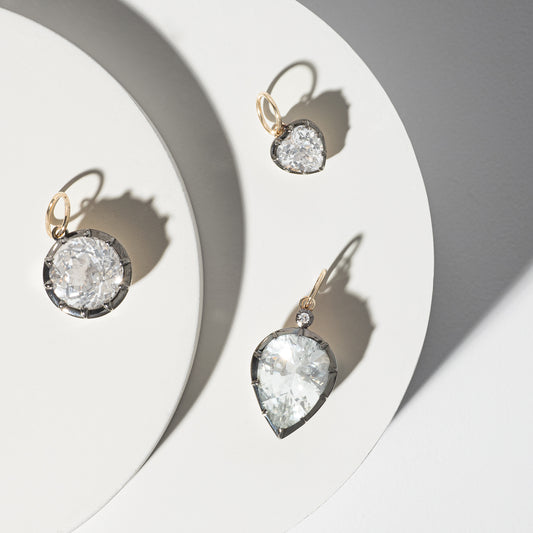 14 Karat Yellow Gold White Topaz Round Charm