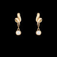 Load image into Gallery viewer, 14 Karat Yellow Gold Knot Diamond Drop Huggie
