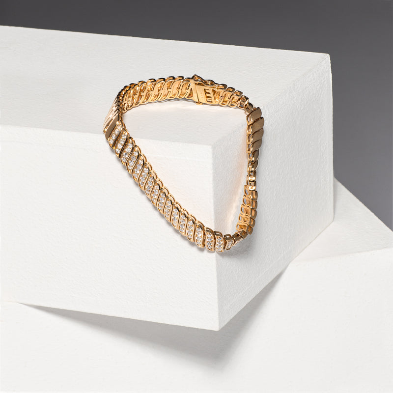 14 Karat Yellow Gold and Diamond Wave bracelet