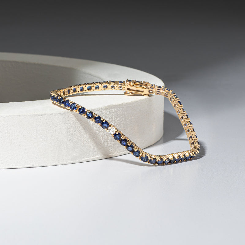 14 Karat Gold Sapphire Tennis Bracelet with Single Diamond