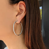 18 Karat White Gold Diamond Oval Hoops
