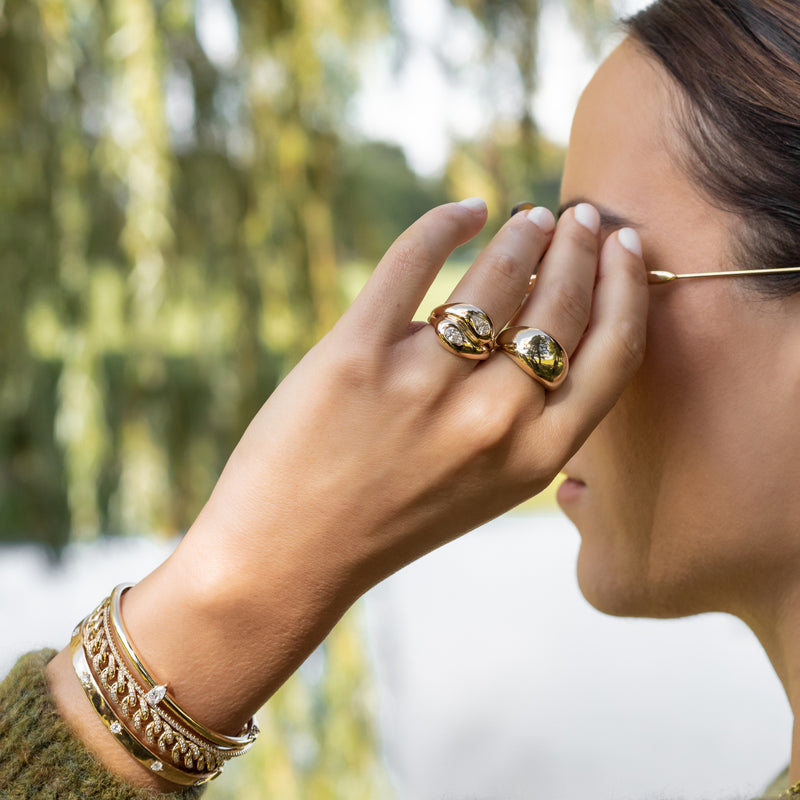 14 Karat Yellow Gold Diamond Pear Twist Ring